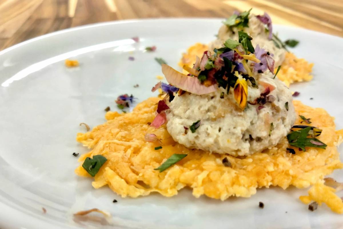 Plated dish with fresh herbs and flowers