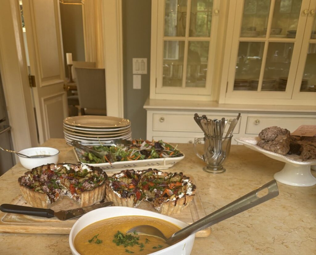 Soup, two vegetable tarts and salad on a mountain house kitchen island in Boone