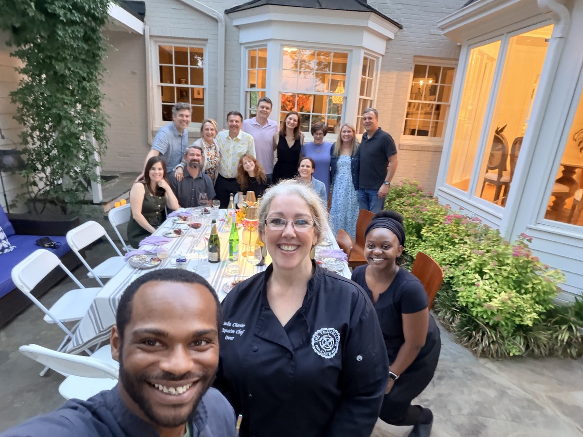 Chefs Lamont and Crene with Leslie and dinner guests on a patio