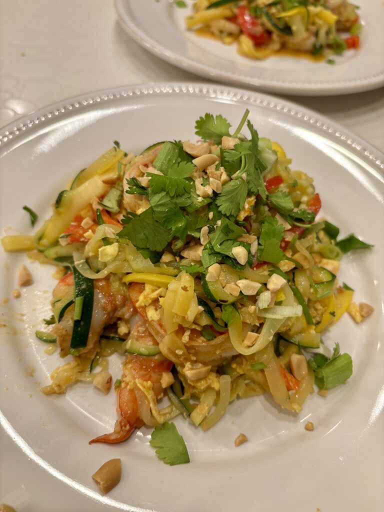 Green papaya salad topped with peanuts, made by a Travelling Cafe chef