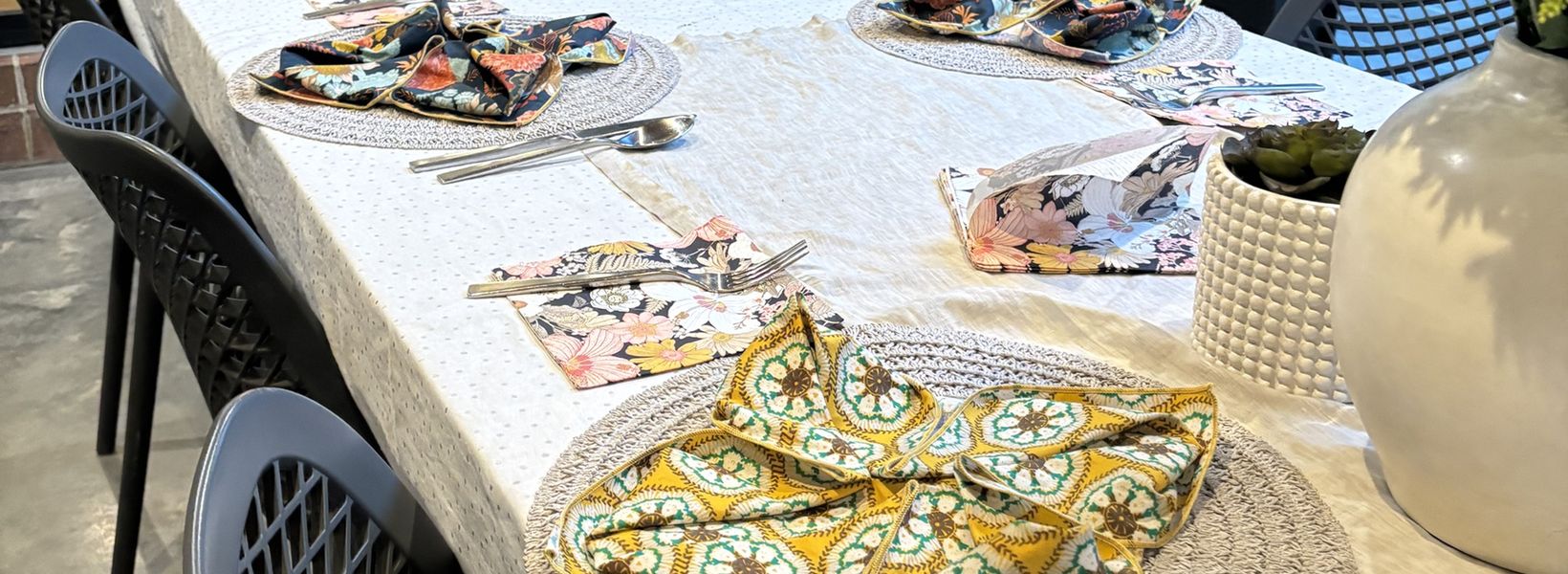 A Travelling Cafe chef setting a dinner party table