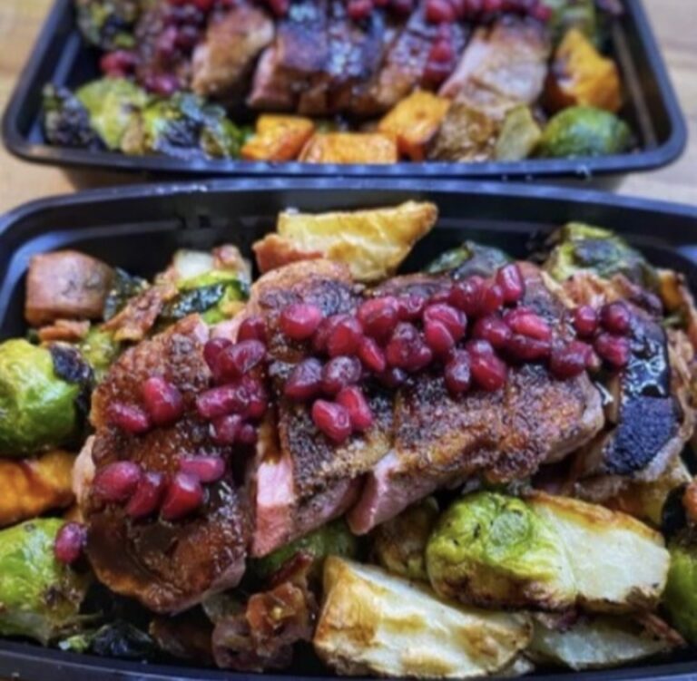 Pomegranate glazed pork with roasted vegetables in weekly meal prep containers