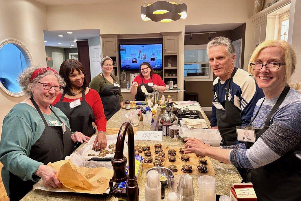 Guests cooking together at The Kitchen Specialist