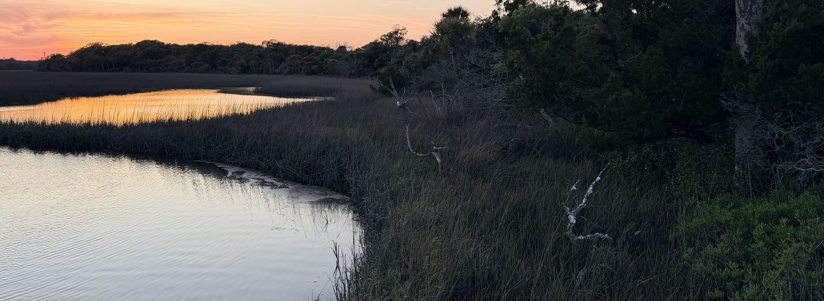 Sunset over a coastal marsh on a vacation cooking trip