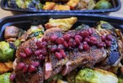 Pomegranate glazed pork with roasted vegetables in weekly meal prep containers